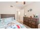 Bedroom featuring Bluey themed comforter set, ceiling fan, and a dresser at 1110 W Heatherbrae Dr, Phoenix, AZ 85013