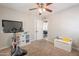 Cozy bedroom with a ceiling fan, storage cube, and comfortable carpeting at 1110 W Heatherbrae Dr, Phoenix, AZ 85013