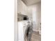 Well-maintained laundry room with modern appliances and great cabinet storage at 1110 W Heatherbrae Dr, Phoenix, AZ 85013