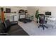 Home office with a treadmill, desk, and comfortable seating, perfect for a productive workspace at 1110 W Heatherbrae Dr, Phoenix, AZ 85013