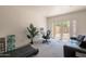 Bright office featuring a desk, comfortable chair, and french doors that lead to the outdoors at 1110 W Heatherbrae Dr, Phoenix, AZ 85013