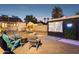 Inviting backyard with projector movie screen, fire pit, and comfortable seating for outdoor relaxation at 1111 E Coronado Rd, Phoenix, AZ 85006