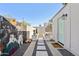 Paver path in backyard with cacti and other plantings leading to back entrance and outbuildings at 1111 E Coronado Rd, Phoenix, AZ 85006
