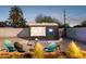Cozy backyard with outdoor movie screen, stylish seating, and landscaping for entertainment at 1111 E Coronado Rd, Phoenix, AZ 85006