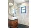 Stylish bathroom showcasing a modern vanity, LED mirror, and glass-enclosed shower with designer fixtures at 1111 E Coronado Rd, Phoenix, AZ 85006