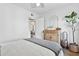 Bright bedroom showcasing a light-filled space, a dresser, and a doorway at 1111 E Coronado Rd, Phoenix, AZ 85006