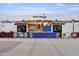 Building with a mural saying, 'Tacos Tijuana', decorated with lights and banners, showing a vibrant atmosphere at 1111 E Coronado Rd, Phoenix, AZ 85006