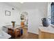 Cozy dining room with hardwood floors, archway, and views into other rooms at 1111 E Coronado Rd, Phoenix, AZ 85006