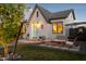 Charming white brick home with a slate roof, inviting front porch, and manicured lawn at 1111 E Coronado Rd, Phoenix, AZ 85006