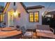 Quaint white brick home with a charming entrance and an inviting outdoor seating area at 1111 E Coronado Rd, Phoenix, AZ 85006