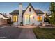 Inviting white brick home featuring a charming entrance, slate roof, and a well-maintained front yard at 1111 E Coronado Rd, Phoenix, AZ 85006