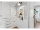 Hallway with built-in cabinets, display niche, and an entryway to other room at 1111 E Coronado Rd, Phoenix, AZ 85006