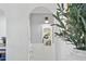 Arched hallway niche with charming decor and design details for this home's interior at 1111 E Coronado Rd, Phoenix, AZ 85006