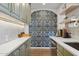 Stylish kitchen boasts stone countertops, modern backsplash, and stainless appliances at 1111 E Coronado Rd, Phoenix, AZ 85006