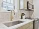 Bright kitchen boasts light countertops, stainless steel sink, and modern appliances at 1111 E Coronado Rd, Phoenix, AZ 85006
