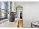 Interior view showing an arched doorway and modern laundry appliances in this stylishly designed home at 1111 E Coronado Rd, Phoenix, AZ 85006