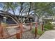 Charming outdoor patio with shaded seating, surrounded by trees and rustic fencing, creating a relaxing atmosphere at 1111 E Coronado Rd, Phoenix, AZ 85006