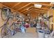 A cluttered interior of a shed features bikes and lots of storage possibilities at 1111 E Coronado Rd, Phoenix, AZ 85006