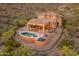 This home offers an inviting pool and an outdoor seating area for entertaining at 11550 E Paradise Ln, Scottsdale, AZ 85255