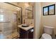 Stylish bathroom with a stone shower, unique sink, and ample counter space for storage at 11550 E Paradise Ln, Scottsdale, AZ 85255
