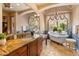 Elegant bathroom with a freestanding tub, marble countertops, and scenic views at 11550 E Paradise Ln, Scottsdale, AZ 85255