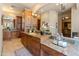 Elegant bathroom featuring stone countertops, arched doorways, custom vanities and cabinetry at 11550 E Paradise Ln, Scottsdale, AZ 85255
