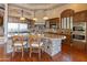 Expansive kitchen with island seating, professional appliances, and custom lighting at 11550 E Paradise Ln, Scottsdale, AZ 85255