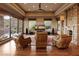 Elegant living room featuring hardwood floors, stone accents, and breathtaking outdoor views at 11550 E Paradise Ln, Scottsdale, AZ 85255