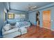 Spacious bedroom with hardwood floors, picturesque windows, and easy access to the bathroom at 11550 E Paradise Ln, Scottsdale, AZ 85255