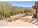 Spacious backyard with desert landscaping and beautiful flower bed at 11550 E Paradise Ln, Scottsdale, AZ 85255