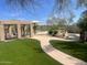 Inviting community pool and spa area with beautiful landscaping and shaded seating at 11550 E Paradise Ln, Scottsdale, AZ 85255