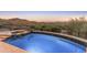 Backyard pool and spa with desert landscaping for privacy at 11550 E Paradise Ln, Scottsdale, AZ 85255