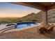 Backyard pool and spa features stunning sunset and mountain views at 11550 E Paradise Ln, Scottsdale, AZ 85255