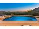Relaxing outdoor pool with integrated spa, offering serene desert views and a perfect spot for unwinding at 11550 E Paradise Ln, Scottsdale, AZ 85255