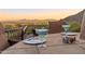 A serene terrace with colorful cocktails and desert views at 11550 E Paradise Ln, Scottsdale, AZ 85255