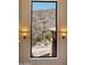Expansive window view showcasing surrounding desert landscape, cacti and natural beauty at 11550 E Paradise Ln, Scottsdale, AZ 85255