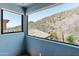 Eye-level view from the window into the mountainous scenery at 11550 E Paradise Ln, Scottsdale, AZ 85255