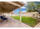Spacious backyard with covered patio and well-maintained lawn, great for entertaining at 13137 W Wilshire Dr, Goodyear, AZ 85395
