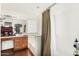 Bright bathroom features wood cabinets, tub with shower, and updated fixtures at 13137 W Wilshire Dr, Goodyear, AZ 85395