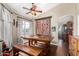 Charming dining room with wood table, bench seating, and decorative accents at 13137 W Wilshire Dr, Goodyear, AZ 85395