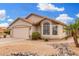 Single-story home with drought-resistant landscaping, a two-car garage, and charming curb appeal at 13137 W Wilshire Dr, Goodyear, AZ 85395