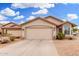 Beautiful single-story home showcasing a two-car garage and desert landscaping in a residential neighborhood at 13137 W Wilshire Dr, Goodyear, AZ 85395