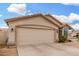 Charming single-story home with a 2-car garage, beautiful windows and desert landscaping at 13137 W Wilshire Dr, Goodyear, AZ 85395