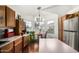 Bright kitchen nook with stainless steel appliances and large windows at 13137 W Wilshire Dr, Goodyear, AZ 85395