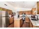 Spacious kitchen featuring stainless steel appliances, wood cabinets, and center island at 13137 W Wilshire Dr, Goodyear, AZ 85395