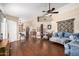 Spacious living room featuring laminate wood flooring and a ceiling fan at 13137 W Wilshire Dr, Goodyear, AZ 85395