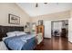 Cozy main bedroom featuring a ceiling fan, natural light, and ensuite bathroom at 13137 W Wilshire Dr, Goodyear, AZ 85395
