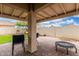 Charming covered patio with brick pavers, perfect for outdoor dining and relaxation at 13137 W Wilshire Dr, Goodyear, AZ 85395