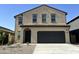 Inviting two-story home with a two car garage and neat landscaping at 13282 E Verbina Ln, Florence, AZ 85132