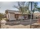 Charming single-story home with covered front porch and chain link fence at 1438 S 112Th Ave, Avondale, AZ 85323